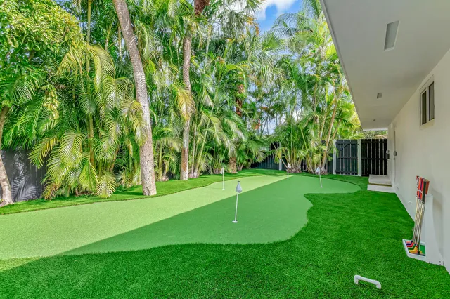 a view of a golf course with a big yard