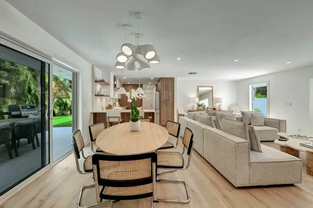 a view of a dining room with furniture window and outside view