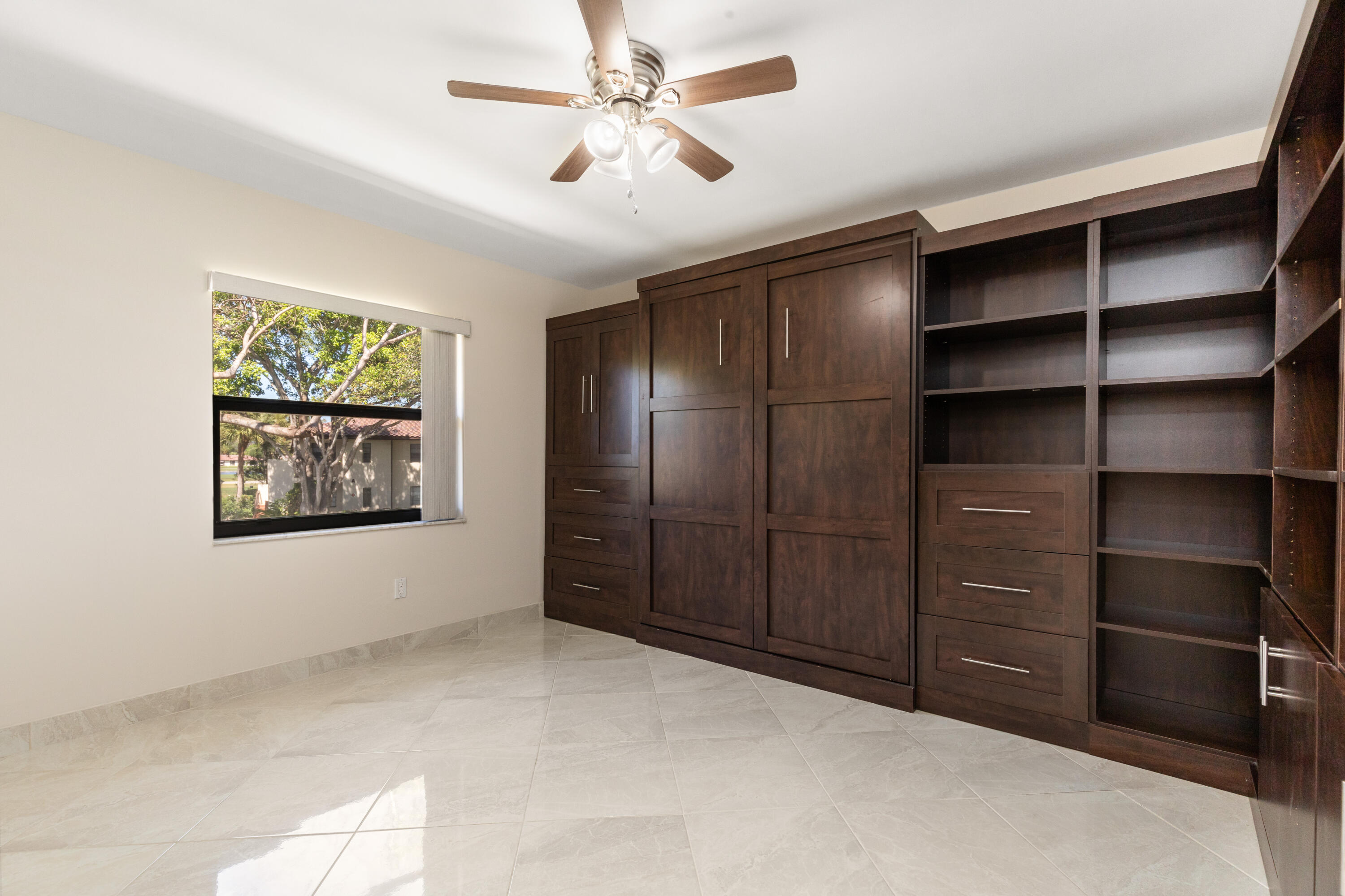 21851 Arriba Real, Unit L Boca Raton, FL 33433 - Photo 37 of 63 Guest bedroom Wall unit