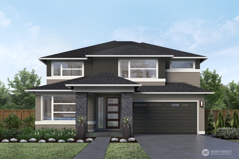 a front view of a house with garden