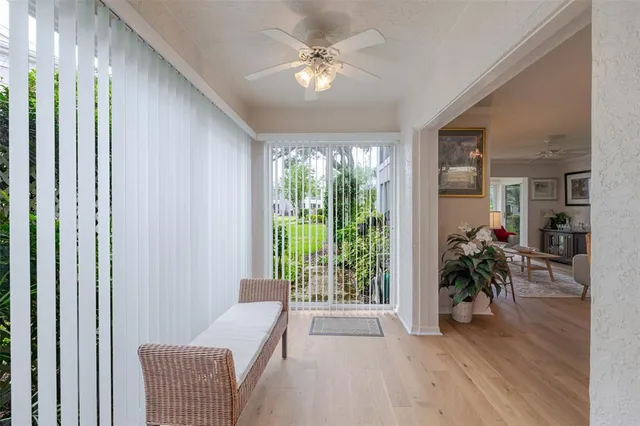 a view of a dining room with furniture wooden floor and chandelier