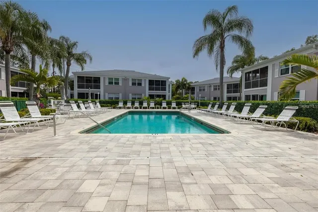 a view of a swimming pool with a lounge chairs