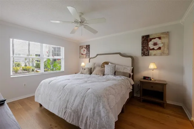 a view of a dining room with furniture a chandelier and wooden floor