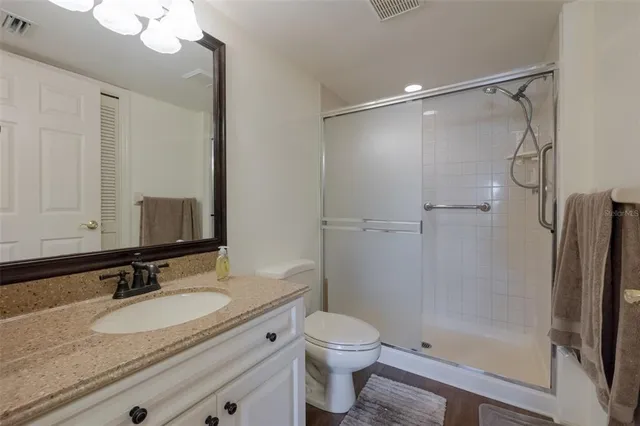 a bedroom with furniture and a flat screen tv