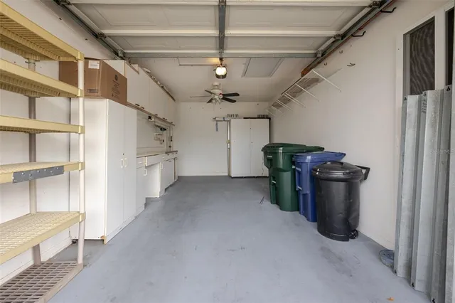 an aerial view of a house with a yard and lake view