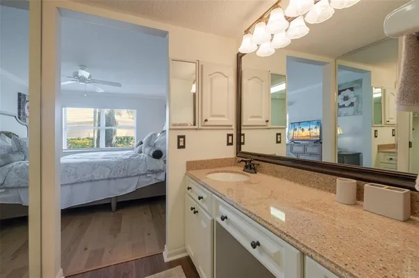 a en suite bathroom with a sink and a mirror