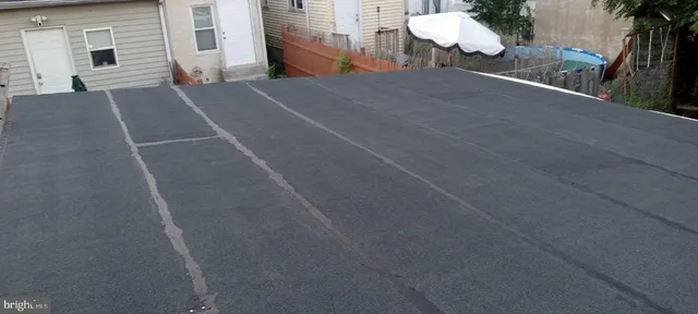 a view of a house with a street