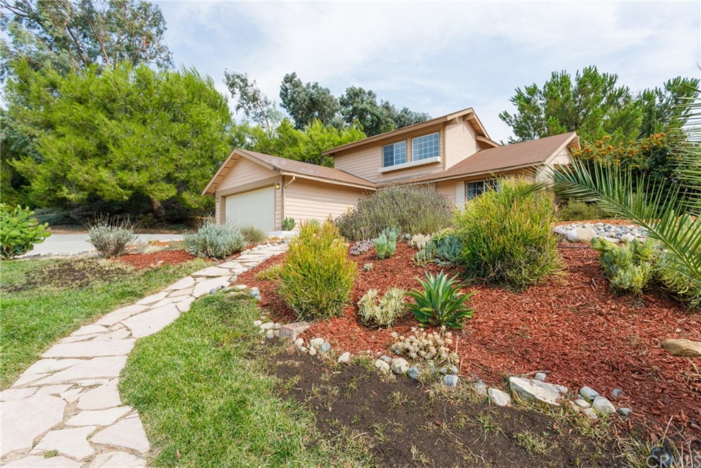 30557 Southern Cross Road Temecula, CA 92592 - Photo 1 of 1 a view of a house with a yard and plants