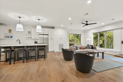 a view of a dining room with furniture window and wooden floor