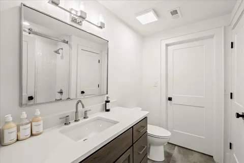a bedroom with a bed and a table