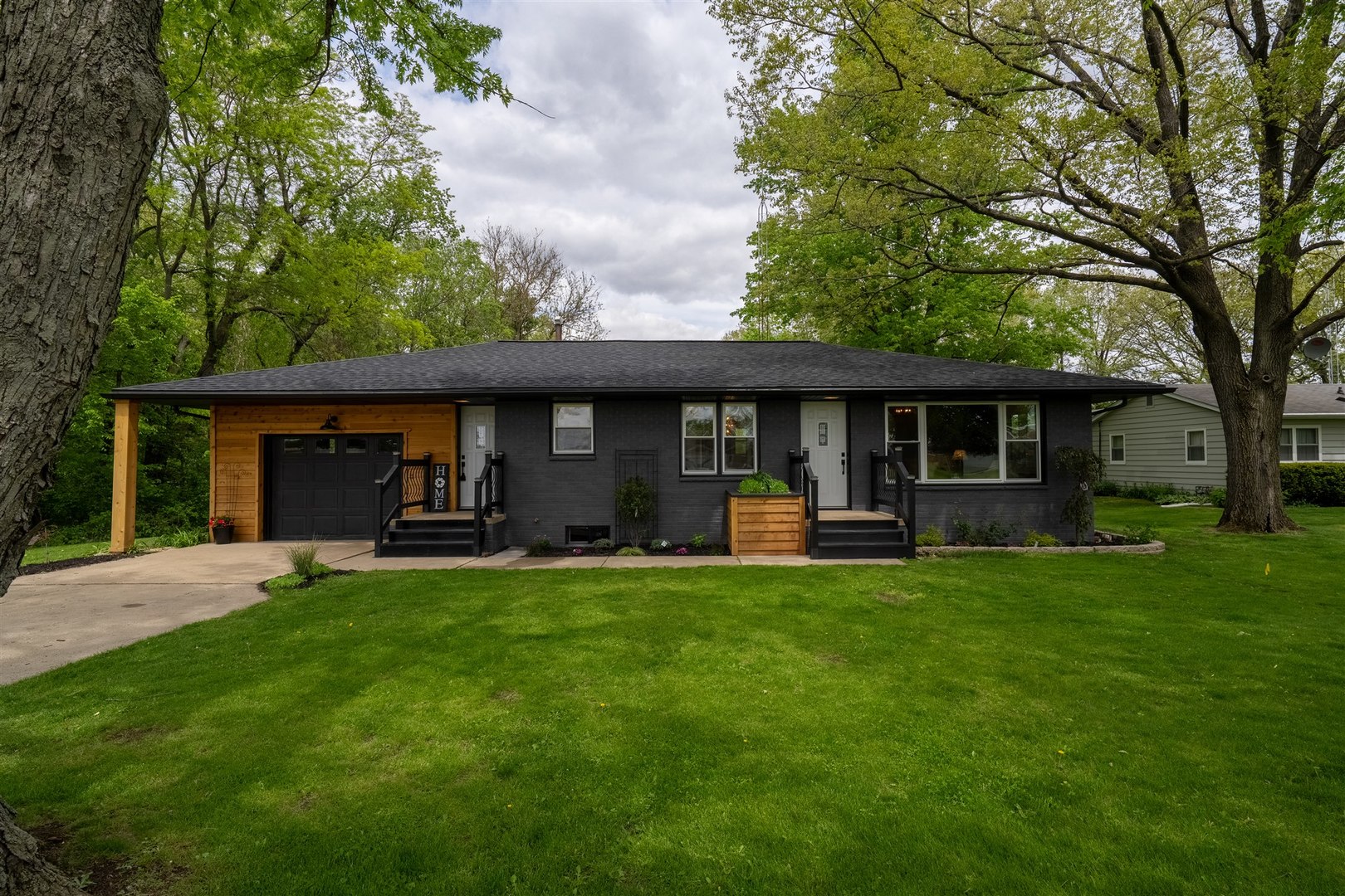 7277 East 3000 N Road Cornell, IL 61319 - Photo 1 of 40 a front view of a house with table and chairs