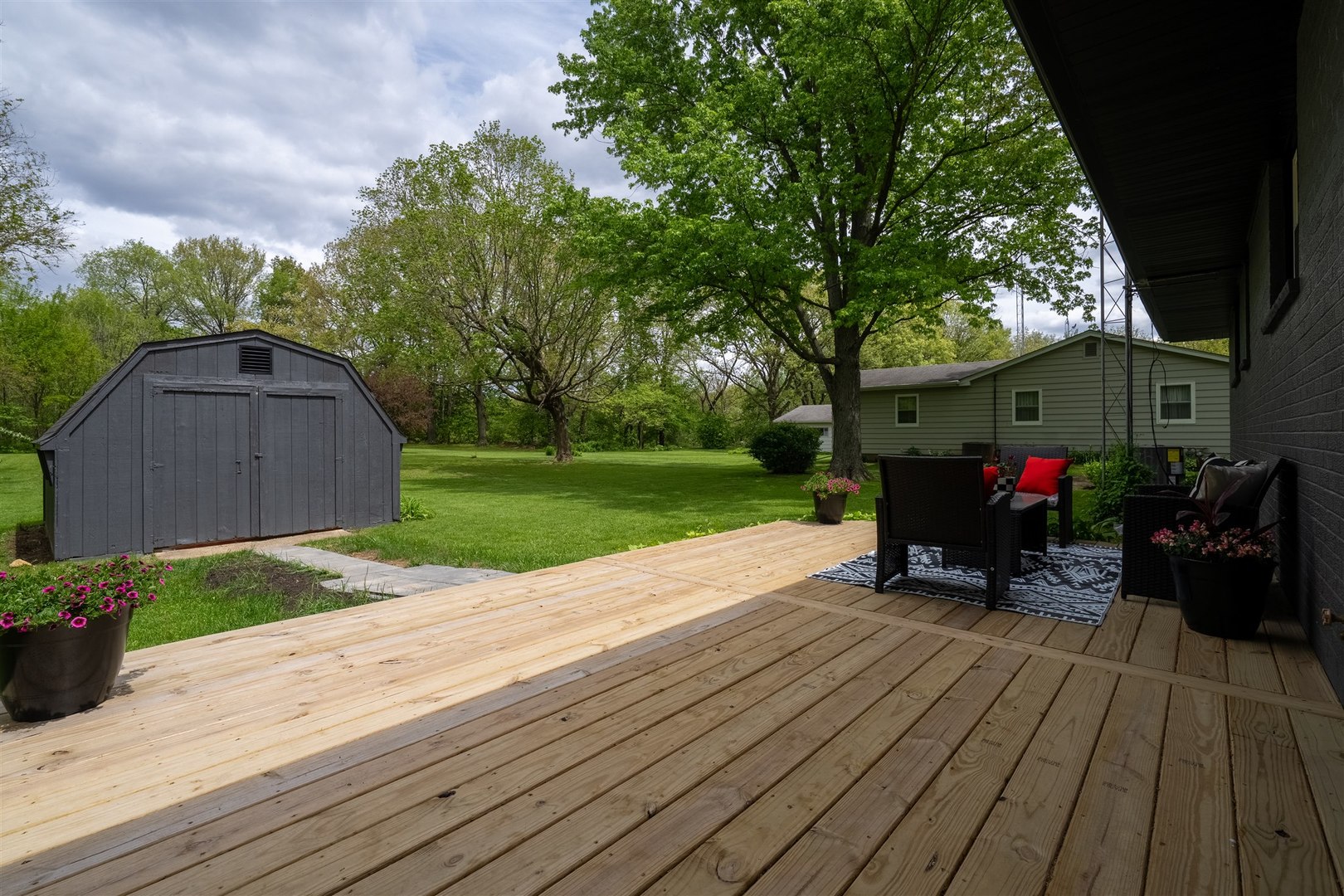 7277 East 3000 N Road Cornell, IL 61319 - Photo 26 of 40 a view of a house with backyard and sitting area