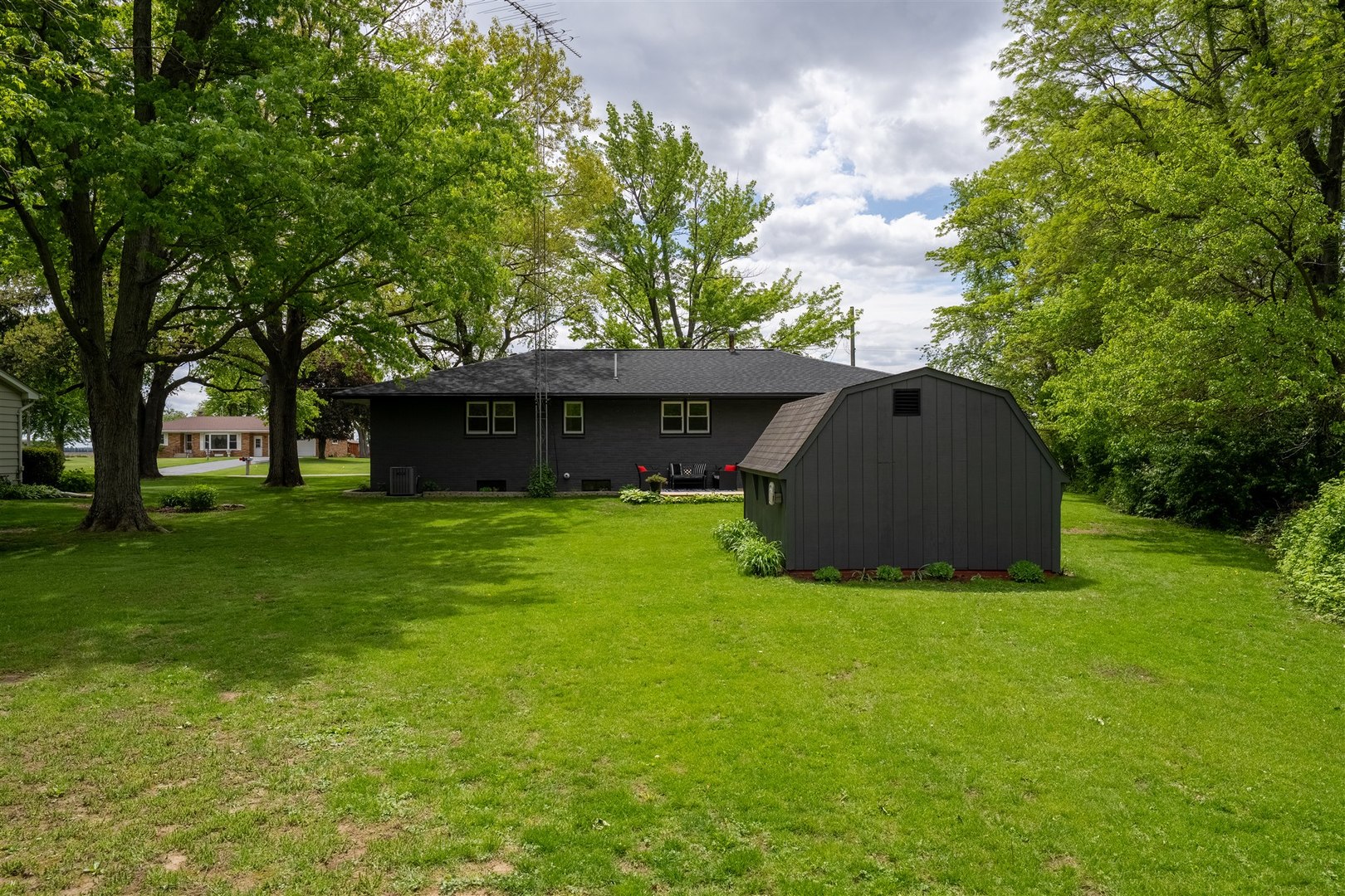 7277 East 3000 N Road Cornell, IL 61319 - Photo 28 of 40 a view of a house with a yard and sitting area