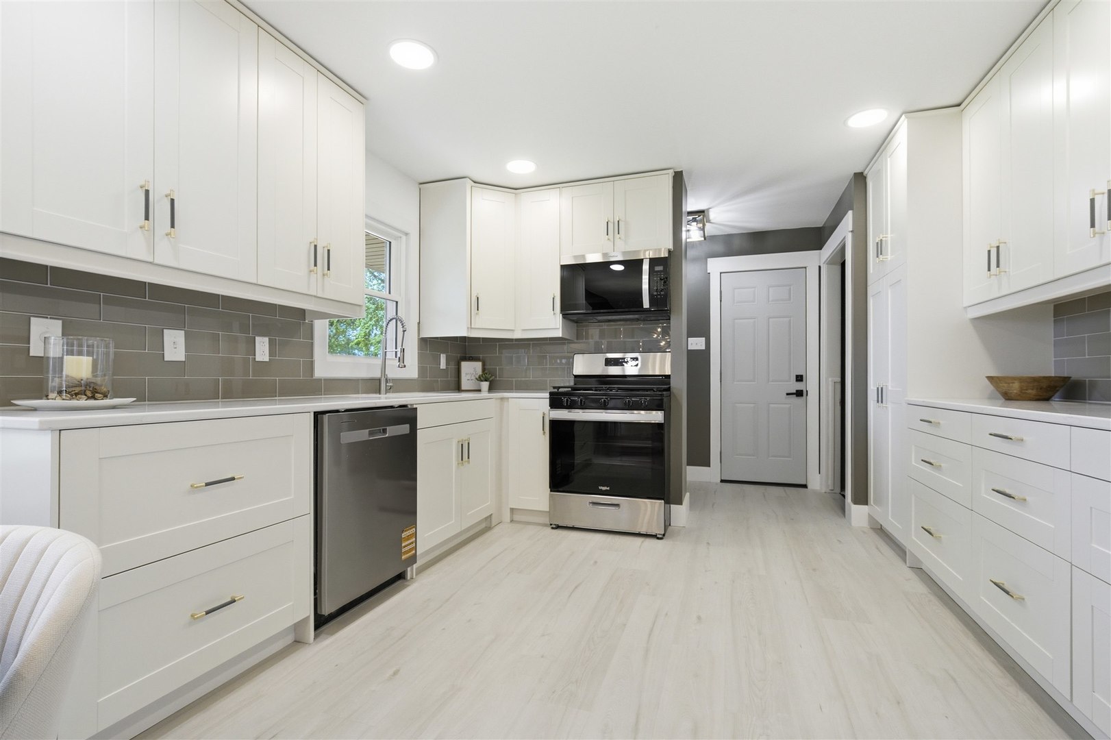 7277 East 3000 N Road Cornell, IL 61319 - Photo 3 of 40 a kitchen with kitchen island white cabinets stainless steel appliances and sink