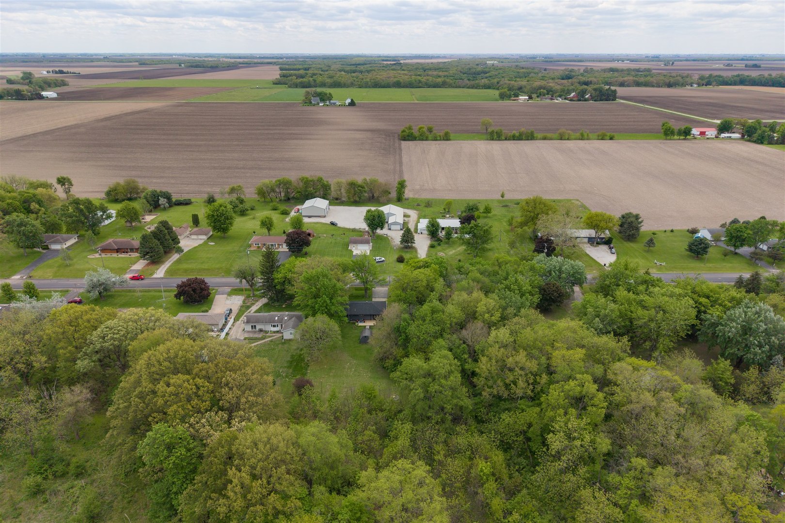 7277 East 3000 N Road Cornell, IL 61319 - Photo 32 of 40 an aerial view of a houses with outdoor space and river