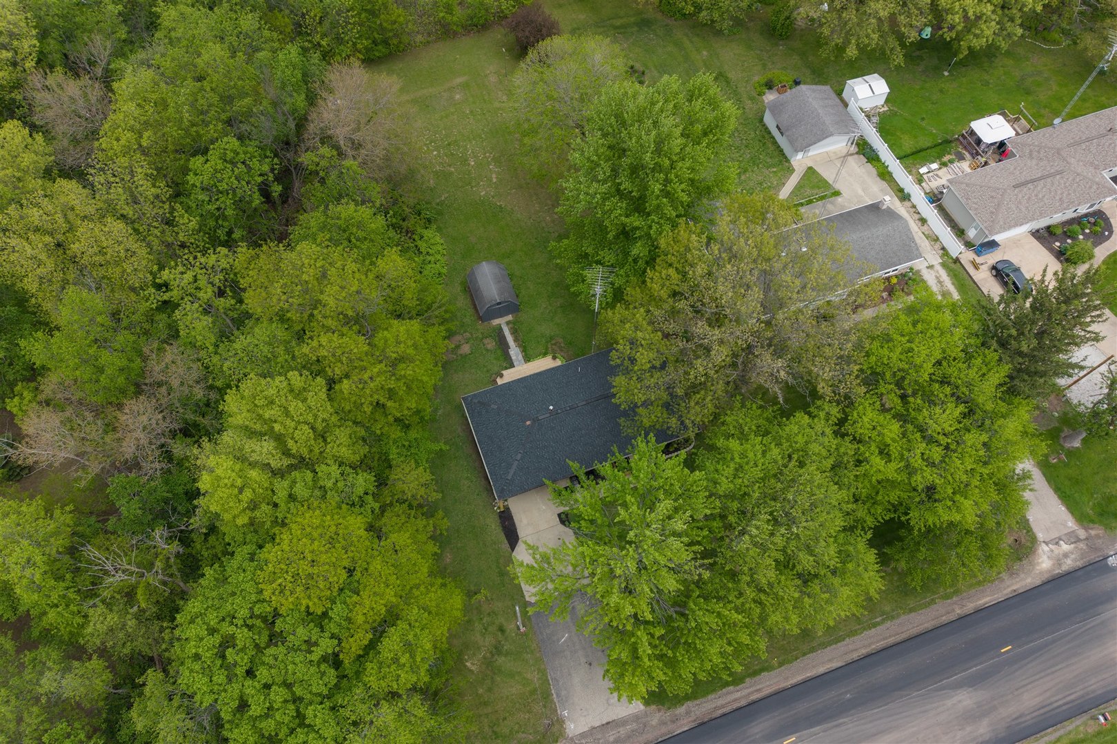 7277 East 3000 N Road Cornell, IL 61319 - Photo 34 of 40 an aerial view of a house with a yard and lake view
