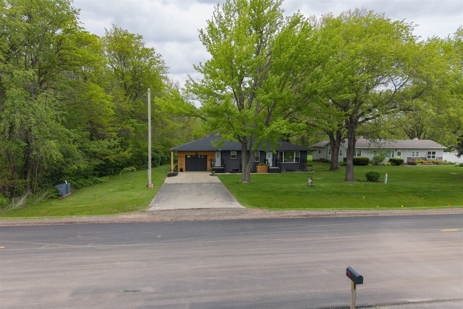 7277 East 3000 N Road Cornell, IL 61319 - Photo 37 of 40 a front view of a house with a yard and trees
