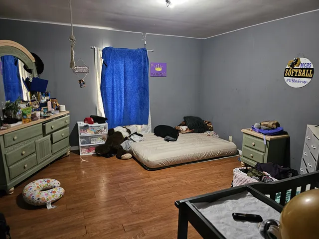 a room with furniture and gym equipment