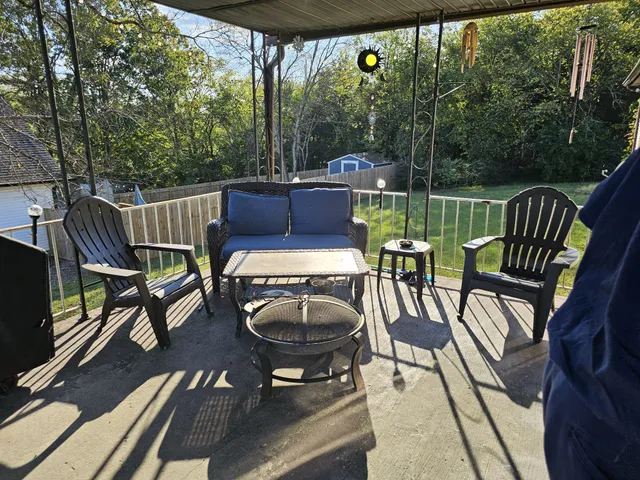 a view of a chairs and table in the patio