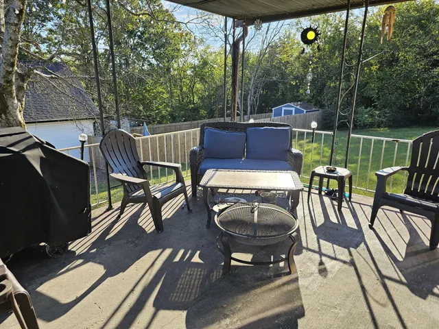 a view of a chairs and table in the patio