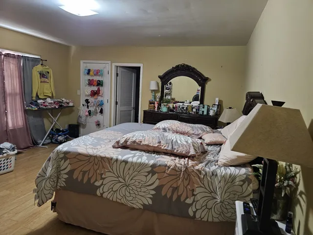 a bedroom with a bed and a table