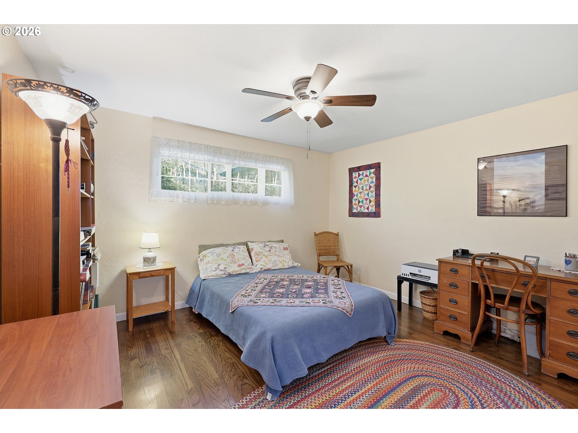 65 Greenvale Drive Springfield, OR 97477 - Photo 25 of 42 a bedroom with a bed and wooden floor