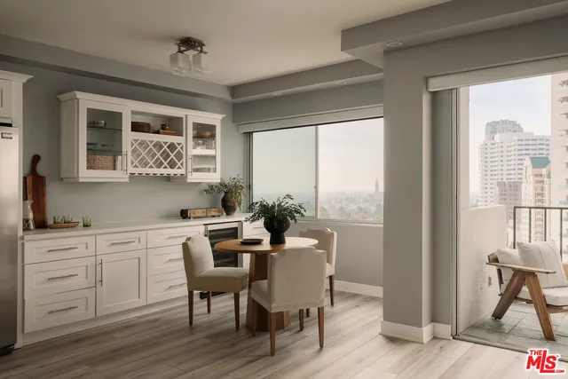 a view of a dining room with furniture window and outside view