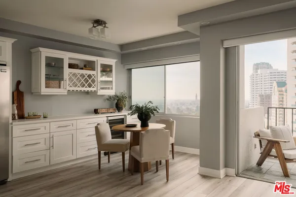 a view of a dining room with furniture window and outside view