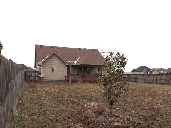 a house that has a tree in front of it