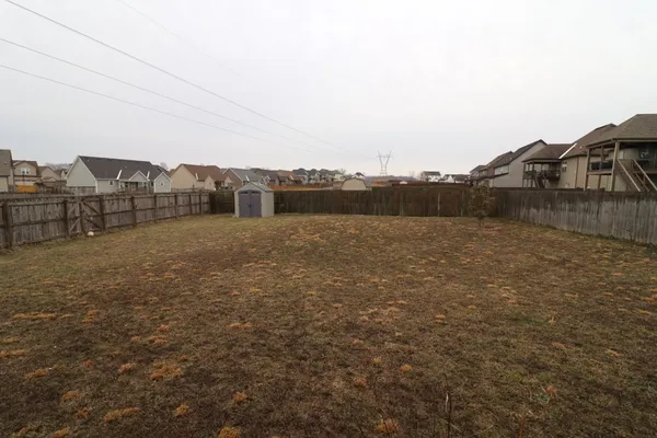 a view of residential houses with outdoor space