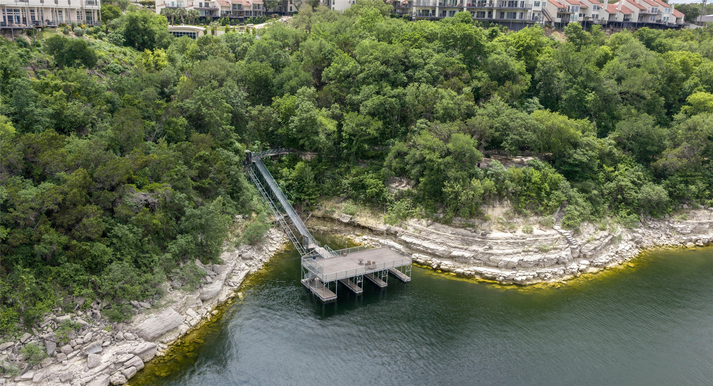2918 Ranch Road 620 North, Unit C122 Austin, TX 78734 - Photo 35 of 36 A private boat dock with a covered seating area is accessible via a funicular from the property, which is set on a wooded hillside overlooking the water