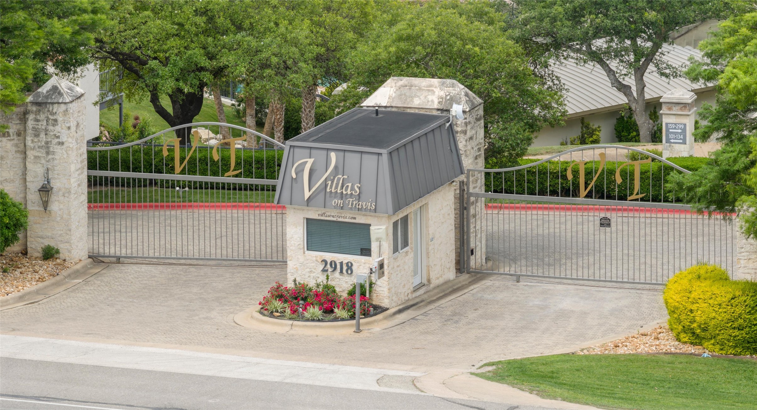 2918 Ranch Road 620 North, Unit C122 Austin, TX 78734 - Photo 36 of 36 The property entrance features stone pillars and a decorative metal gate
