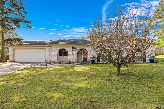 a backyard of a house with lots of green space