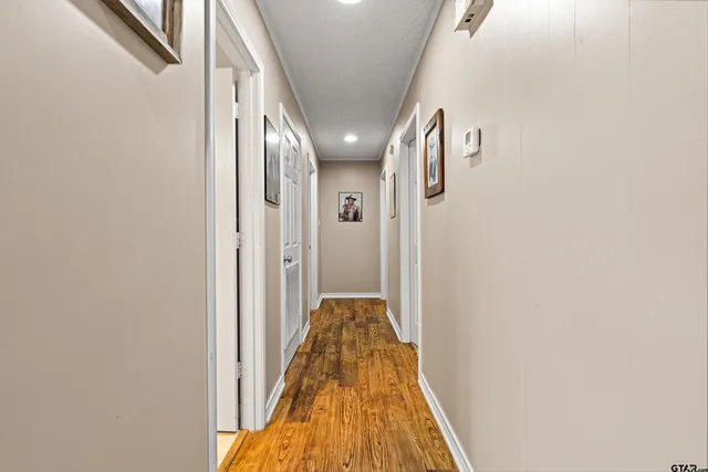a view of a hallway with windows