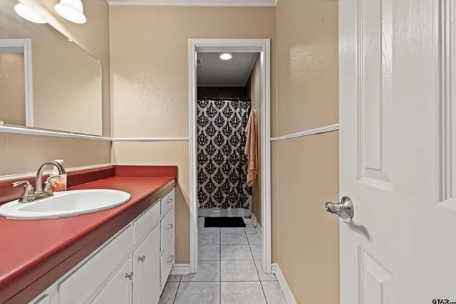 a bathroom with a sink and a mirror