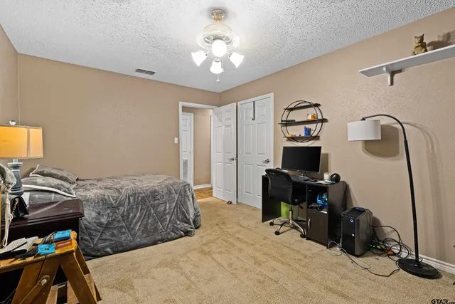 a bedroom with a workspace