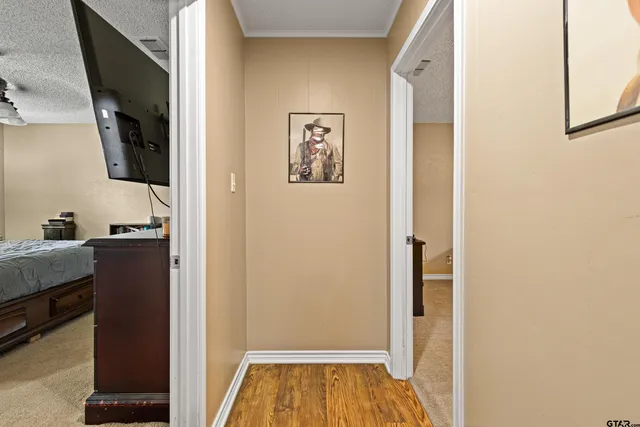 a view of hallway with wooden floor