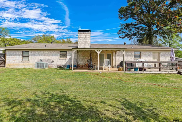 a front view of house with yard and seating area