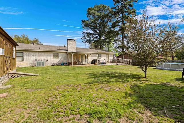 a view of a house with a big yard