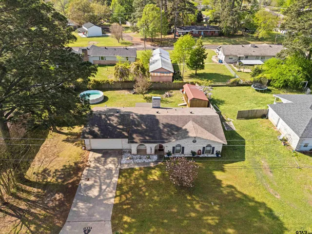 a view of a swimming pool with a yard