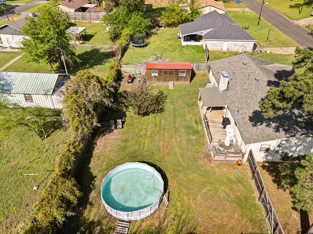 an aerial view of residential house with swimming pool