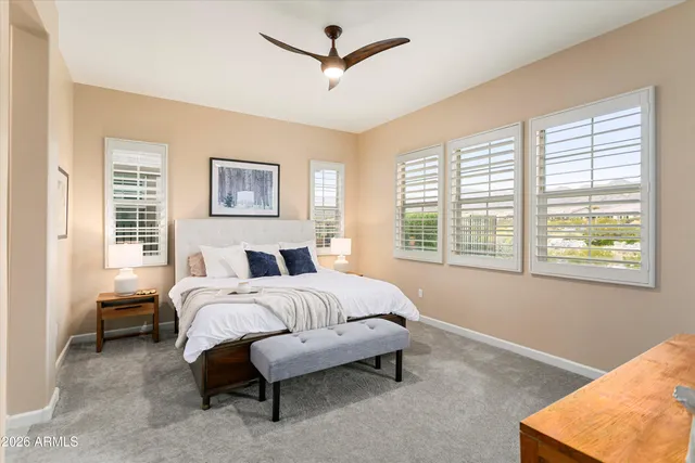 a bedroom with a bed and a mirror