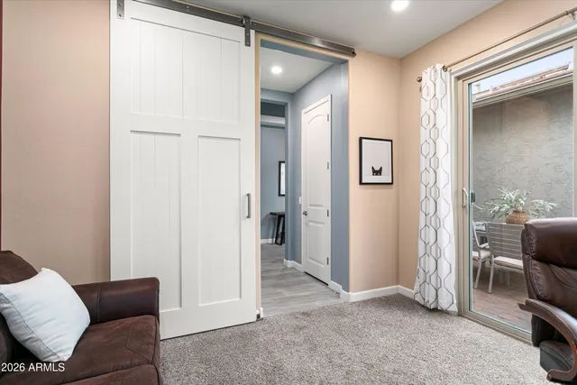 a bathroom with a granite countertop toilet sink and mirror