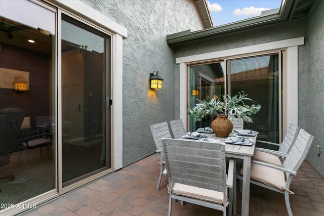 a view of a patio with couches chairs