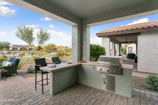 an aerial view of a house with a yard and balcony