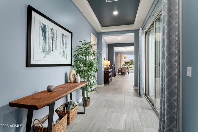 a view of a hallway with furniture and entryway