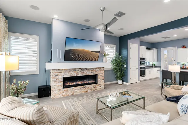a living room with furniture and a fireplace