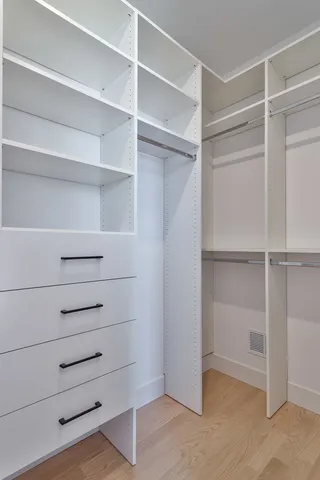 a view of an empty walk in closet