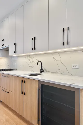 a kitchen with a sink and cabinets