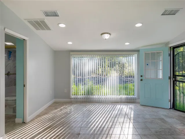 a view of livingroom with floor to ceiling window